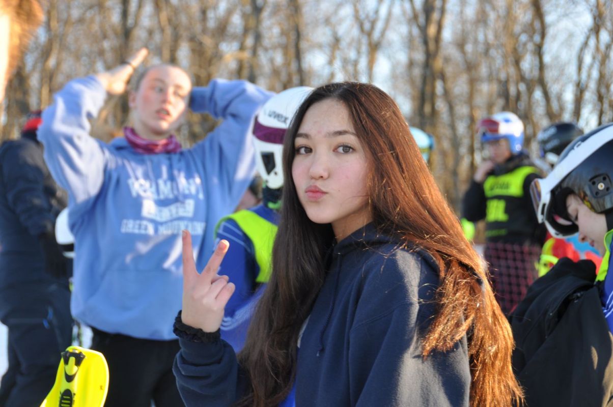 Rachel with the infamous hand gesture| JV Championships